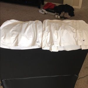 4 Nike Women’s tennis skirts. 3 are size XS 1 SM